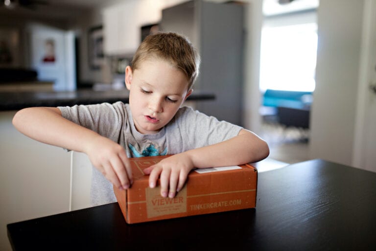 Monthly Subscription Boxes for Kids -Boy Opening a Box