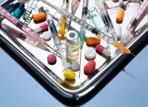 What is Degenerative Osteoarthritis- My Aching Bones  - A Variety of Syringes and Drugs on a Medical Tray