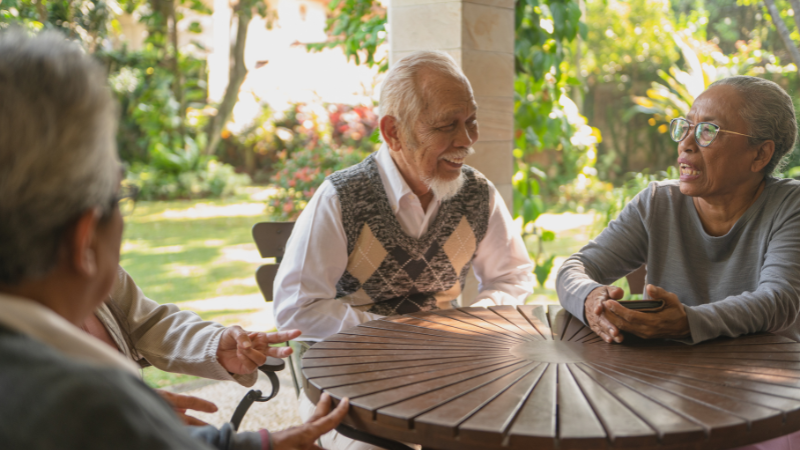 Dealing with Negative Elderly Parents Effective Strategies - Older men setting around table talking