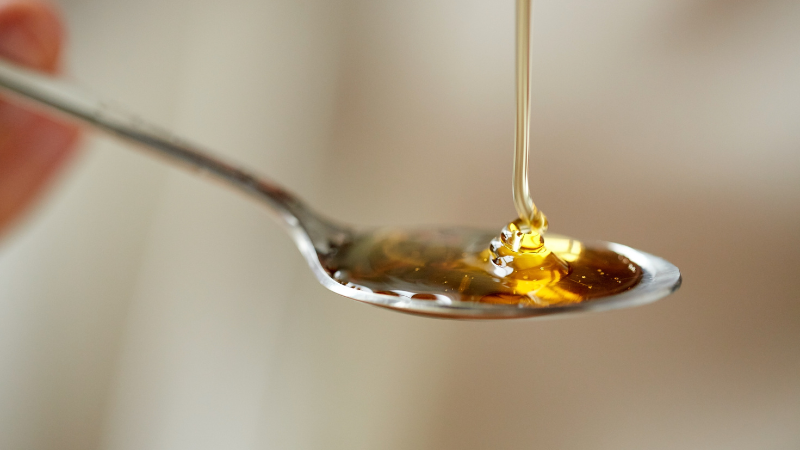 Is Raw Honey Safe For Elderly - teaspoon of honey
