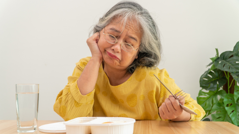 How Long Can Elderly Individuals Live Without Eating Food - older woman looking disinterested in food.