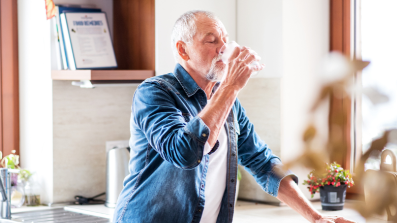 How To Increase Sodium Levels In Elderly Naturally - Man drinking water