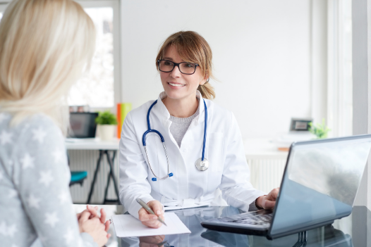 Preparing For Surgery Checklist - Doctor talking with patient. 