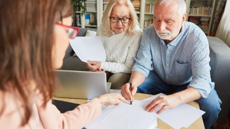 The Benefits of getting older - older couple looking over finances