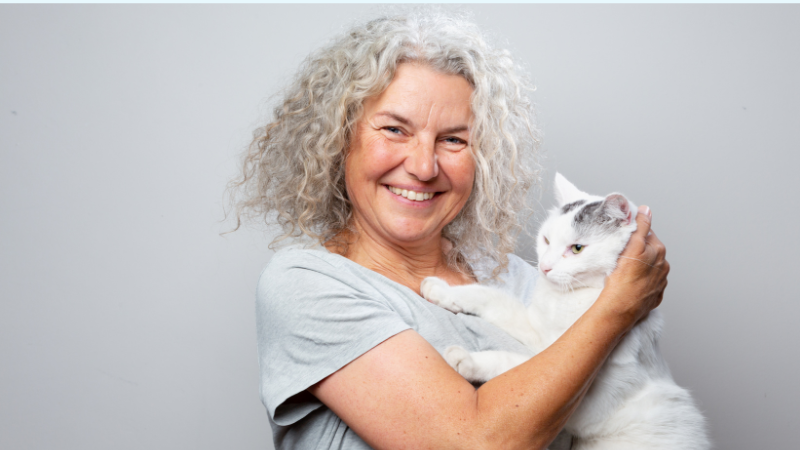 What Are Robotic Pets For Adults - Woman holding cat