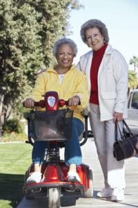 Electric Scooters for Seniors Buyers Guide - Woman on Mobility Scooter